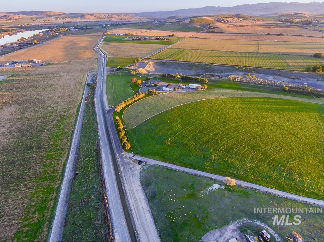 Tbd Canal Street Marsing, ID 83639 - Photo 9 of 13 Aerial overview of property's location featuring large plots for crops, rural landscape, and a mountain backdrop