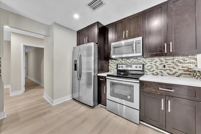 a bathroom with a sink double vanity and a mirror