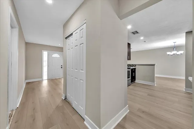 a view of a livingroom from a hallway