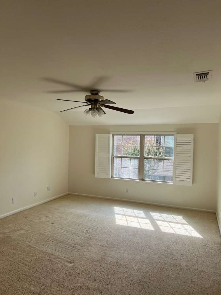 5817 Valley Forge Drive, Unit 90 Houston, TX 77057 - Photo 13 of 21 an empty room with a empty space and windows
