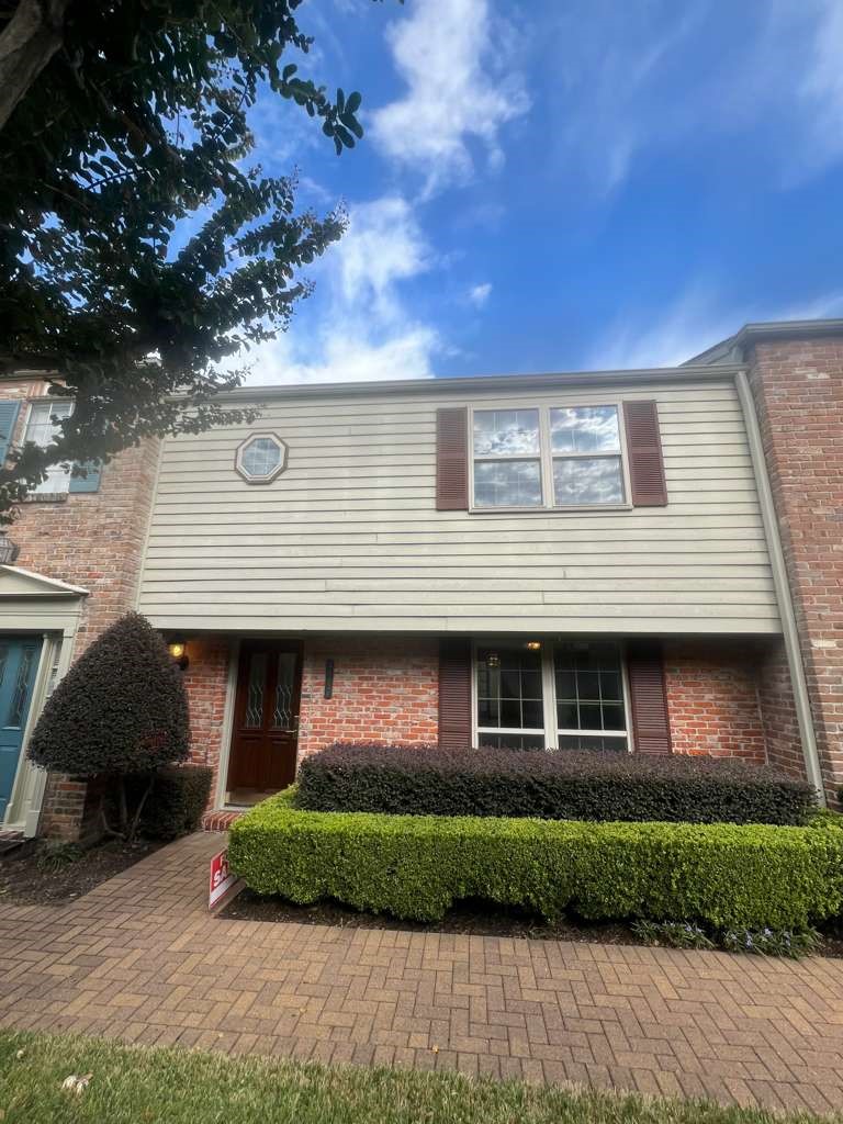 5817 Valley Forge Drive, Unit 90 Houston, TX 77057 - Photo 2 of 21 a front view of a house with a garden