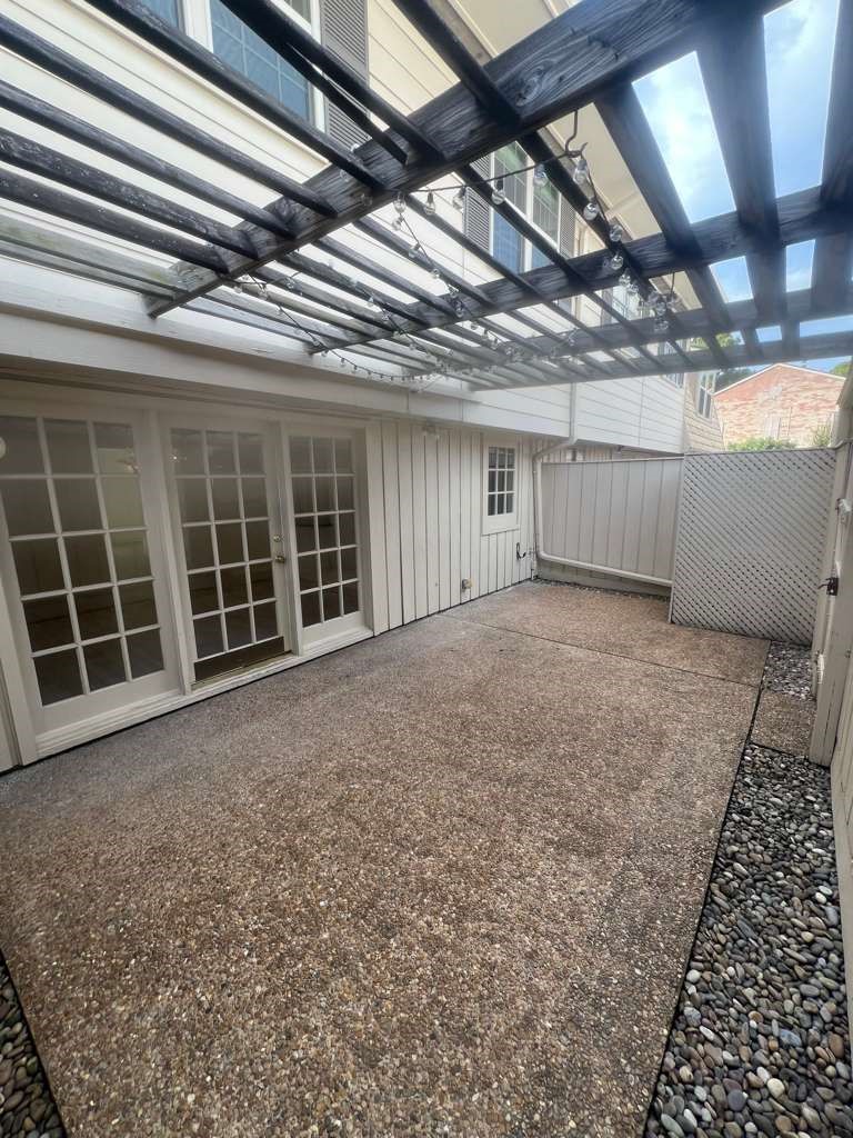 5817 Valley Forge Drive, Unit 90 Houston, TX 77057 - Photo 10 of 21 a view of an empty room with windows