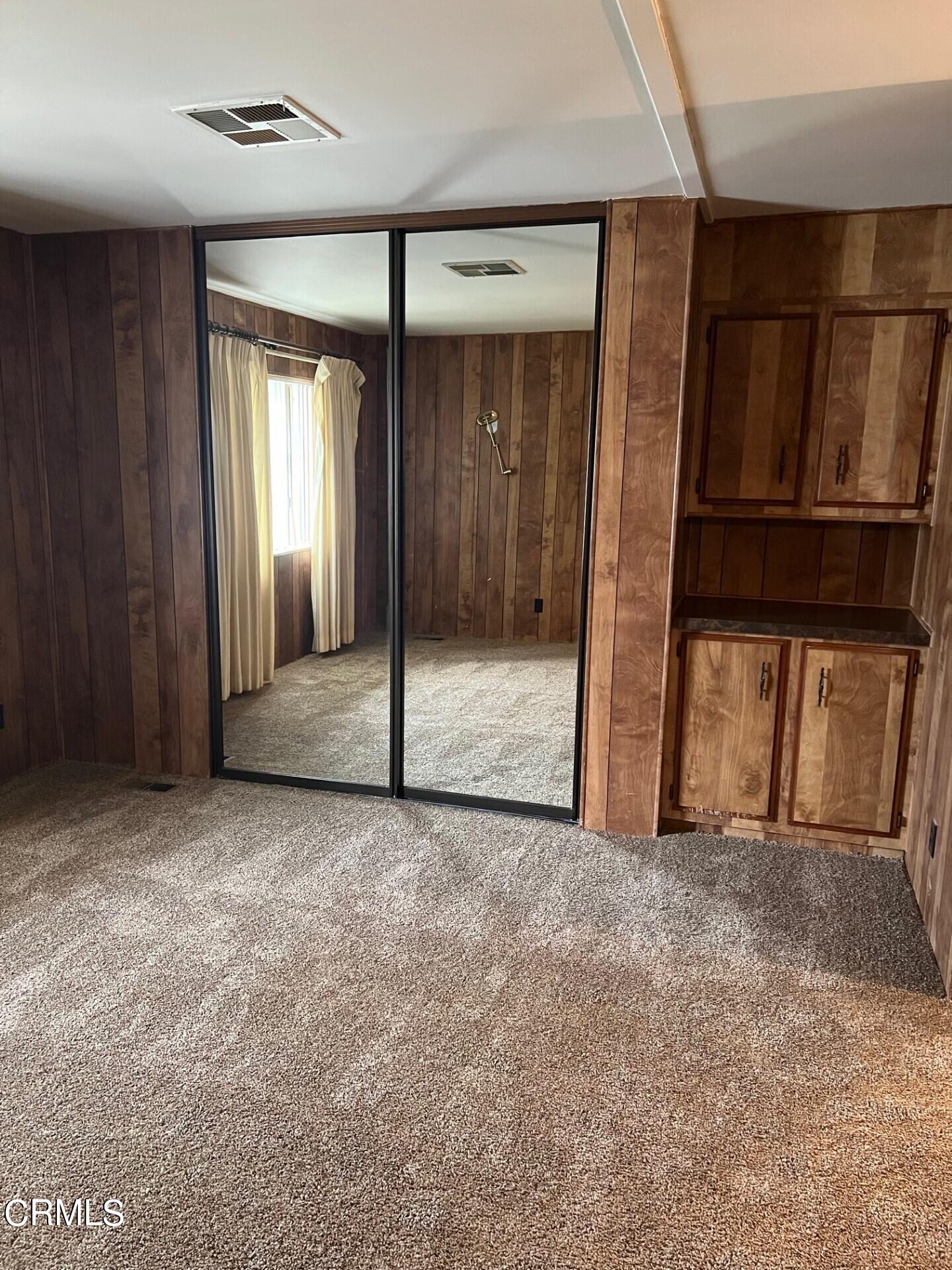 3700 Olds Road, Unit 86 Oxnard, CA 93033 - Photo 9 of 12 a view of an empty room with a fireplace