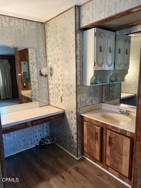 3700 Olds Road, Unit 86 Oxnard, CA 93033 - Photo 10 of 12 a bathroom with a granite countertop sink a mirror and shower