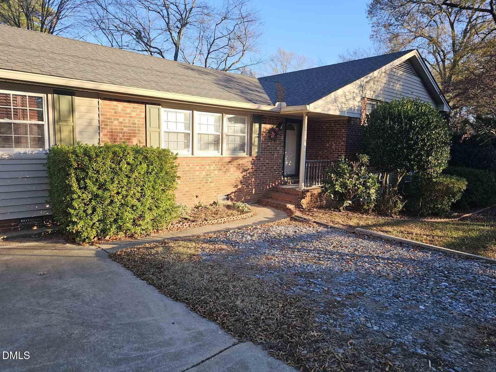 711 Kildaire Farm Road Cary, NC 27511 - Photo 4 of 6 a front view of a house with garden