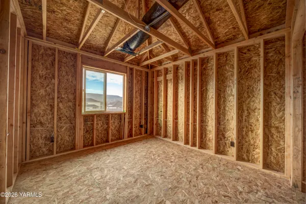 a view of a room with large windows