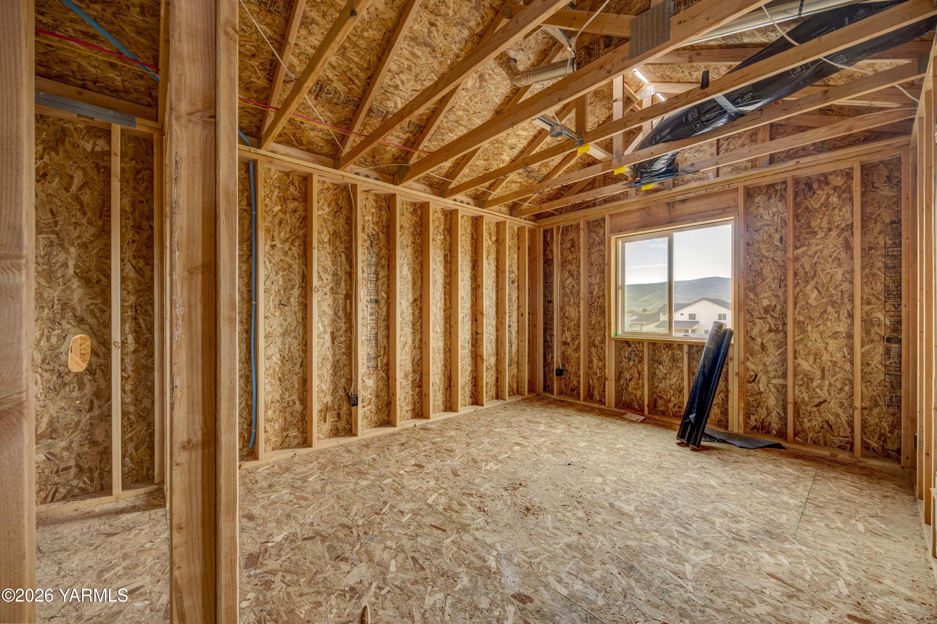 215 Packer Street Prosser, WA 99350 - Photo 13 of 38 a view of a room with large windows