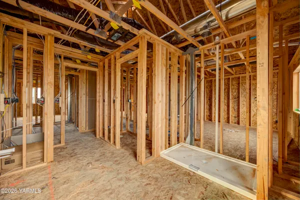 a view of kitchen with kitchen island and stainless steel appliances