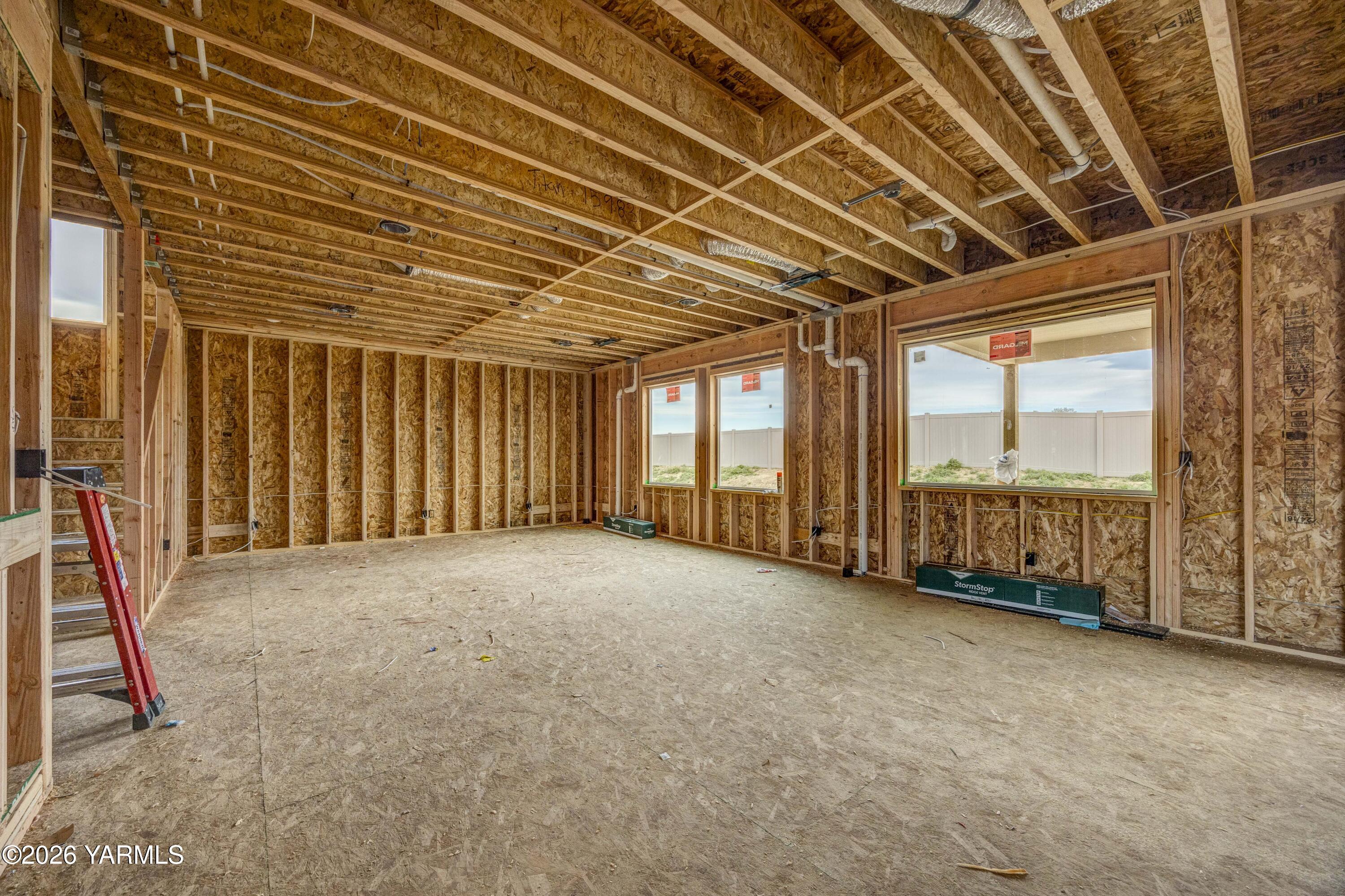 215 Packer Street Prosser, WA 99350 - Photo 2 of 38 a view of an empty room with windows