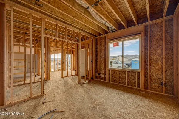 a view of an empty room with a sliding door