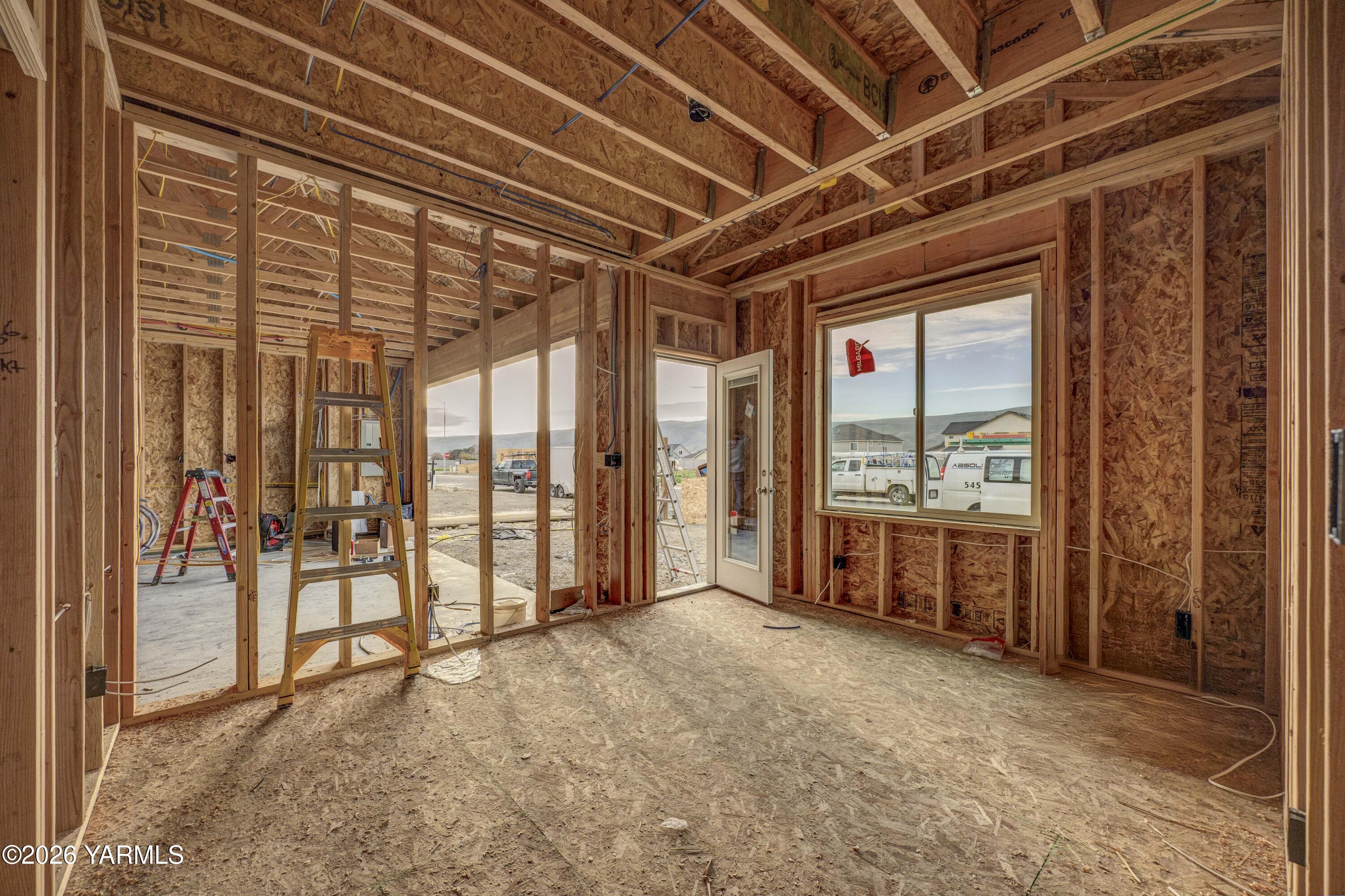215 Packer Street Prosser, WA 99350 - Photo 8 of 38 a view of an empty room with a sliding door