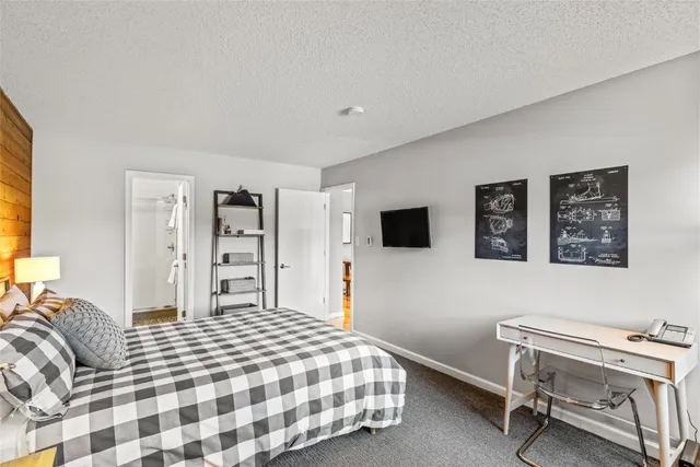 a bedroom with a bed and a chair