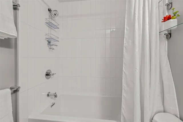 a bathroom with a shower curtain