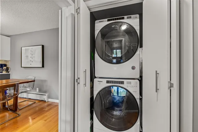 a view of a hallway with washer and dryer