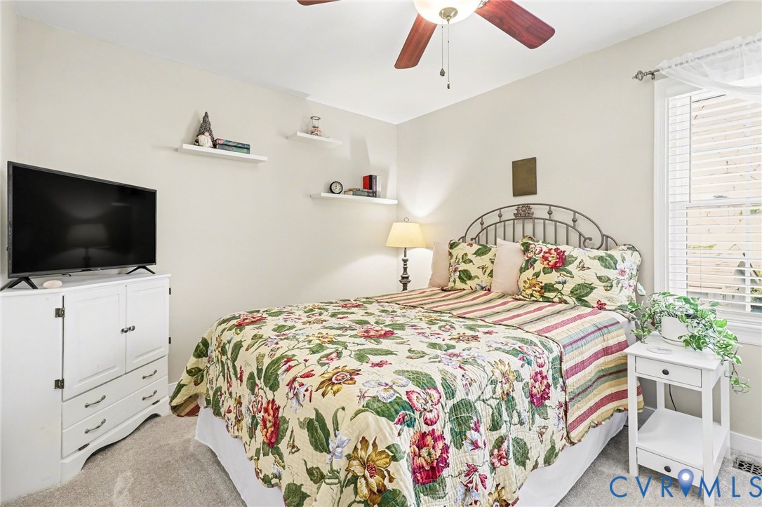 548 Glenmeadow Road Midlothian, VA 23114 - Photo 16 of 31 a bedroom with a bed and a flat screen tv