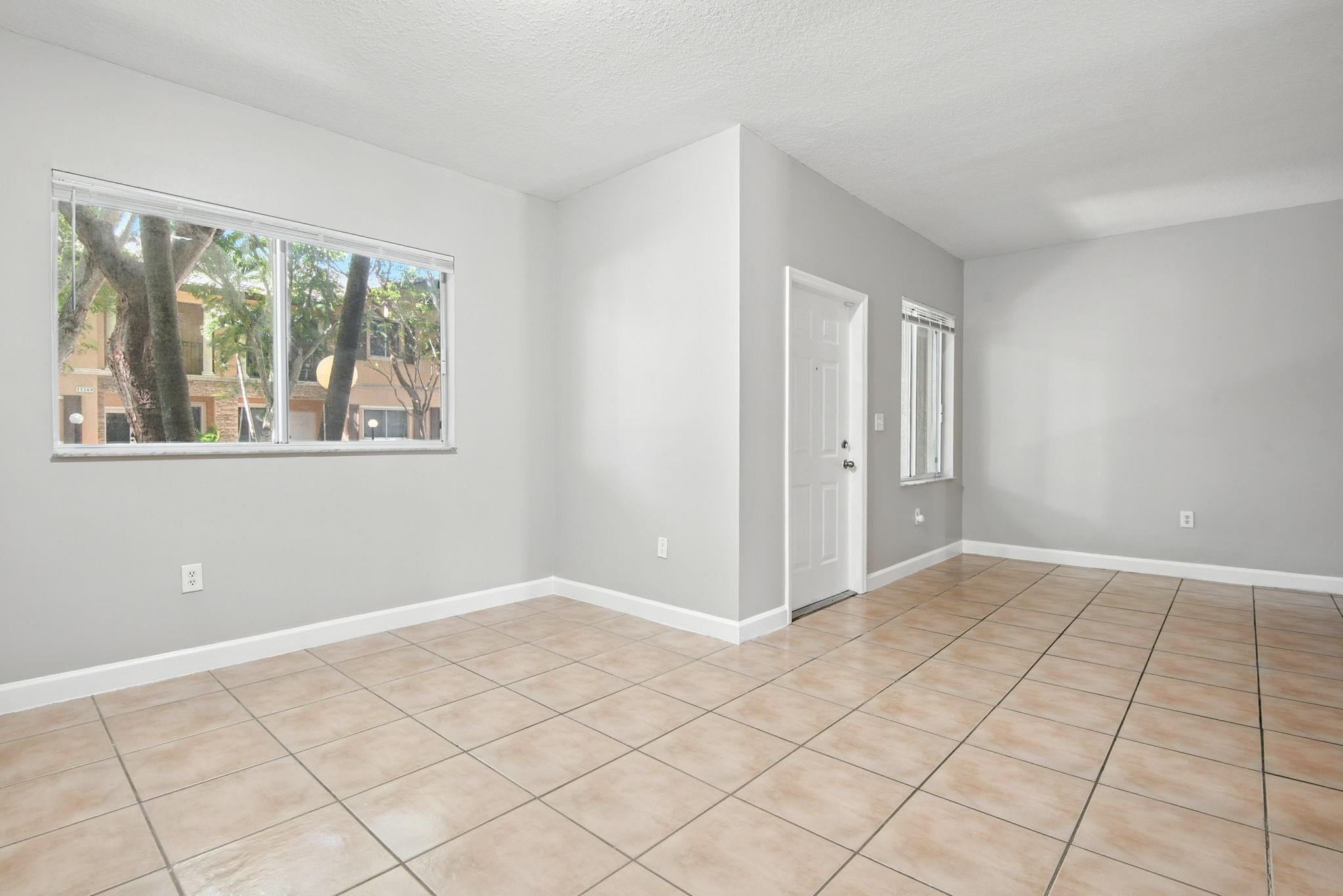 11368 Southwest 230th Terrace Miami, FL 33170 - Photo 14 of 37 a view of an empty room with window