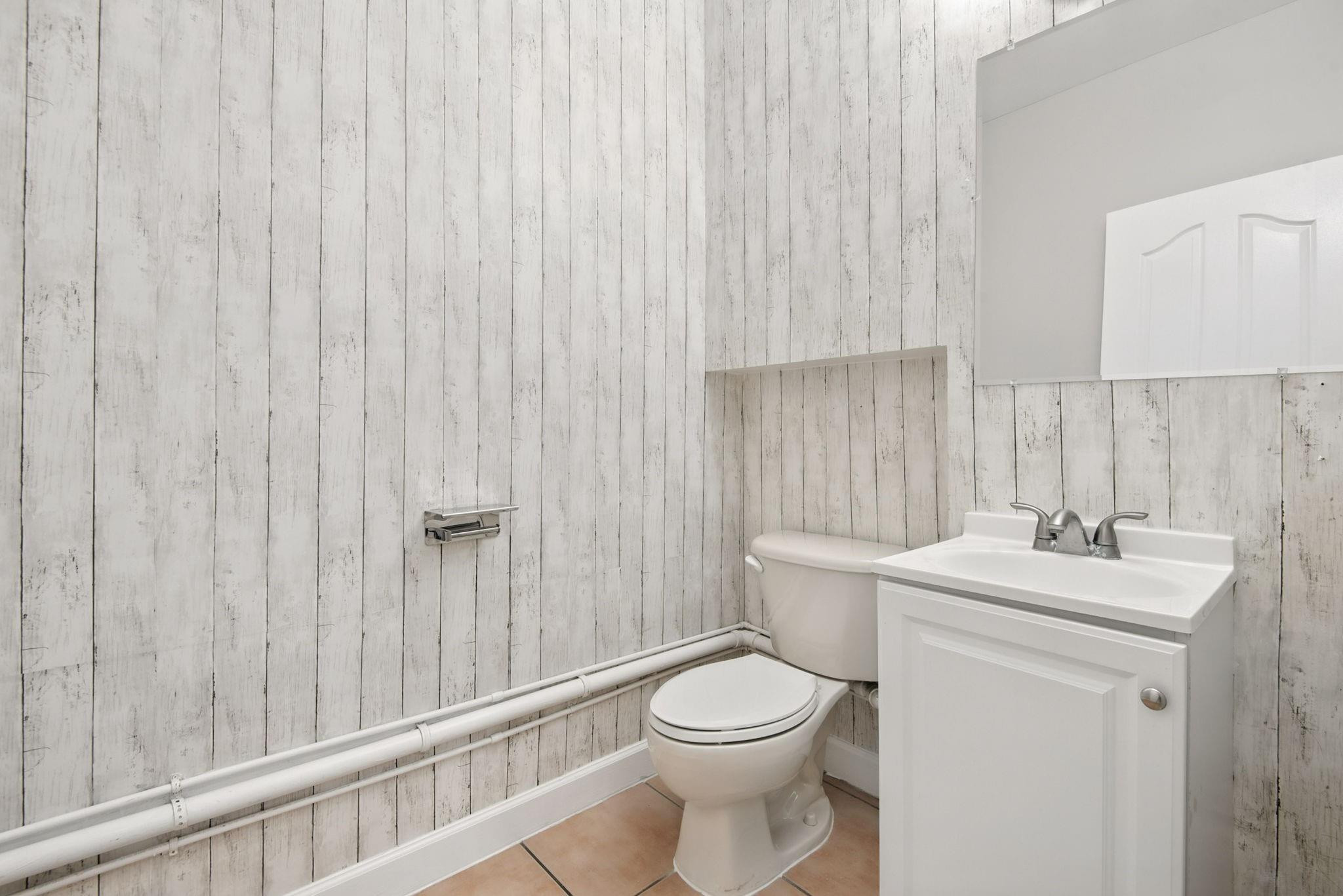 11368 Southwest 230th Terrace Miami, FL 33170 - Photo 17 of 37 a bathroom with a toilet a sink and a shower curtain