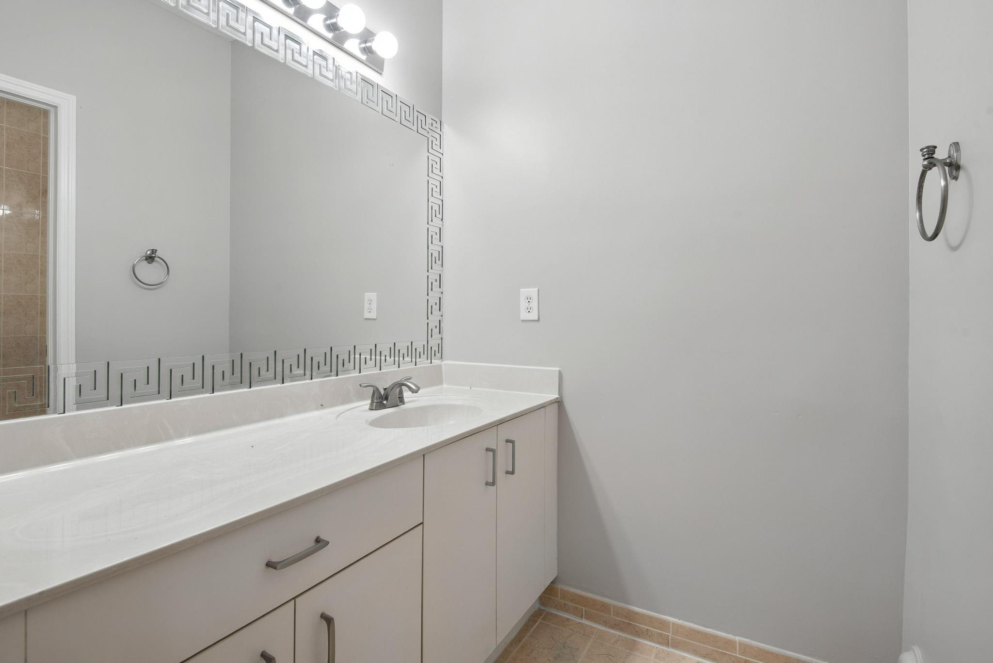 11368 Southwest 230th Terrace Miami, FL 33170 - Photo 24 of 37 a bathroom with a sink and a mirror