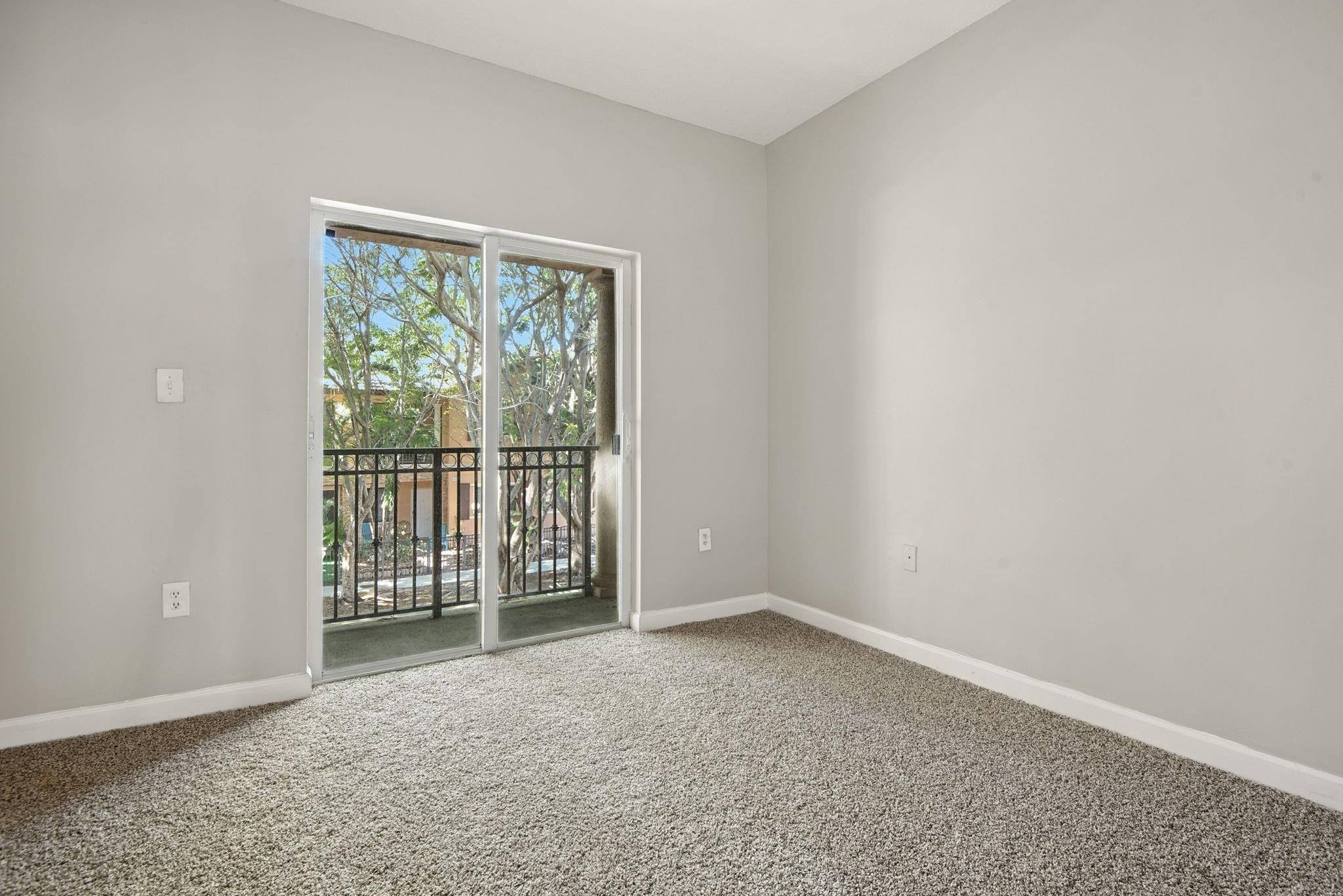 11368 Southwest 230th Terrace Miami, FL 33170 - Photo 25 of 37 an empty room with sliding door