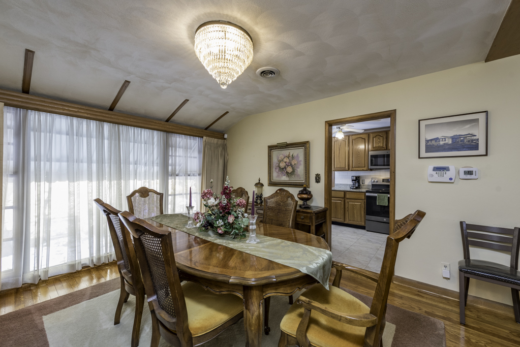1118 Shiloh Boulevard Zion, IL 60099 - Photo 11 of 33 a view of a dining room with furniture window and wooden floor