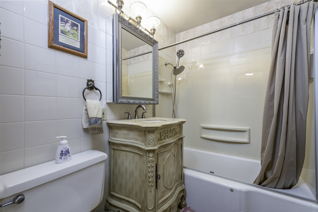 1118 Shiloh Boulevard Zion, IL 60099 - Photo 19 of 33 a bathroom with a sink toilet and shower