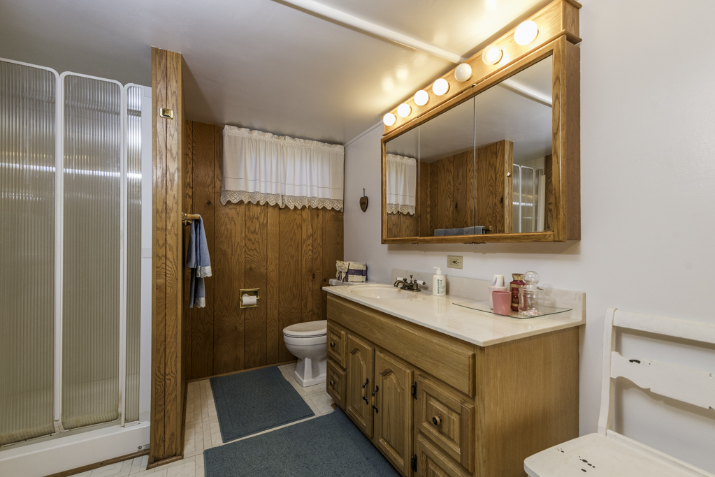 1118 Shiloh Boulevard Zion, IL 60099 - Photo 27 of 33 a bathroom with a double vanity sink mirror and toilet