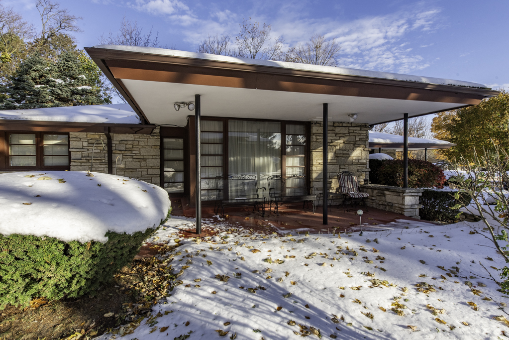 1118 Shiloh Boulevard Zion, IL 60099 - Photo 3 of 33 a view of a patio with table and chairs under an umbrella