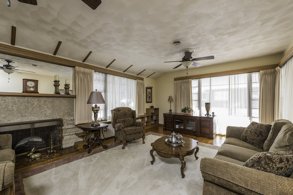 1118 Shiloh Boulevard Zion, IL 60099 - Photo 6 of 33 a living room with furniture and a fireplace