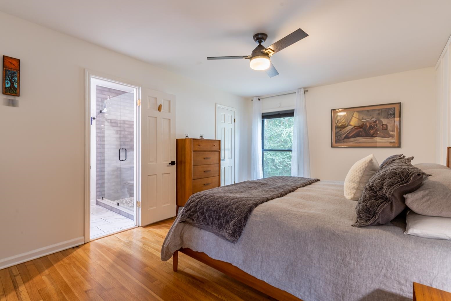 6270 Quince Road Memphis, TN 38119 - Photo 15 of 28 Bedroom featuring light hardwood / wood-style flooring, connected bathroom, and ceiling fan