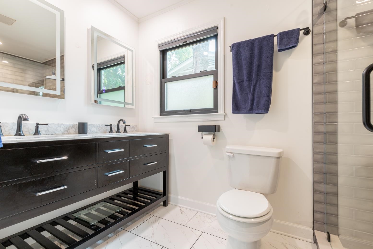 6270 Quince Road Memphis, TN 38119 - Photo 17 of 28 Bathroom featuring vanity, toilet, and a shower
