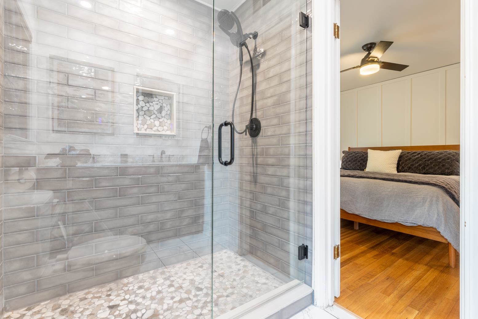 6270 Quince Road Memphis, TN 38119 - Photo 18 of 28 Bathroom featuring a shower with door, ceiling fan, and hardwood / wood-style flooring
