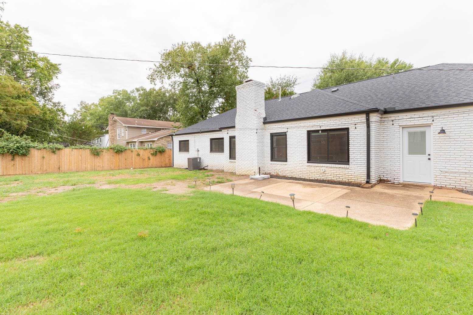 6270 Quince Road Memphis, TN 38119 - Photo 24 of 28 Rear view of property featuring a lawn, a patio area, and central AC
