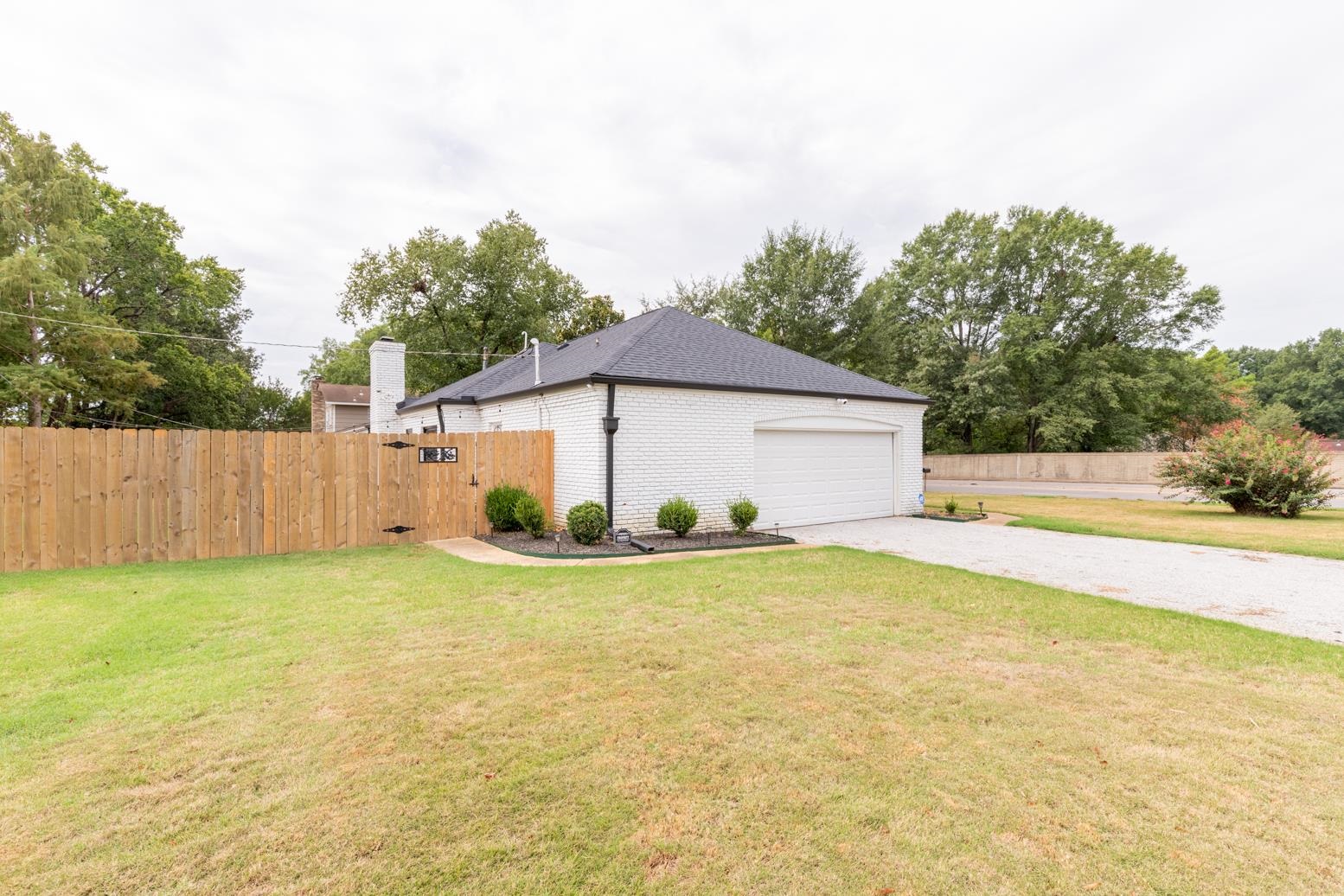 6270 Quince Road Memphis, TN 38119 - Photo 27 of 28 View of home's exterior with a yard and a garage