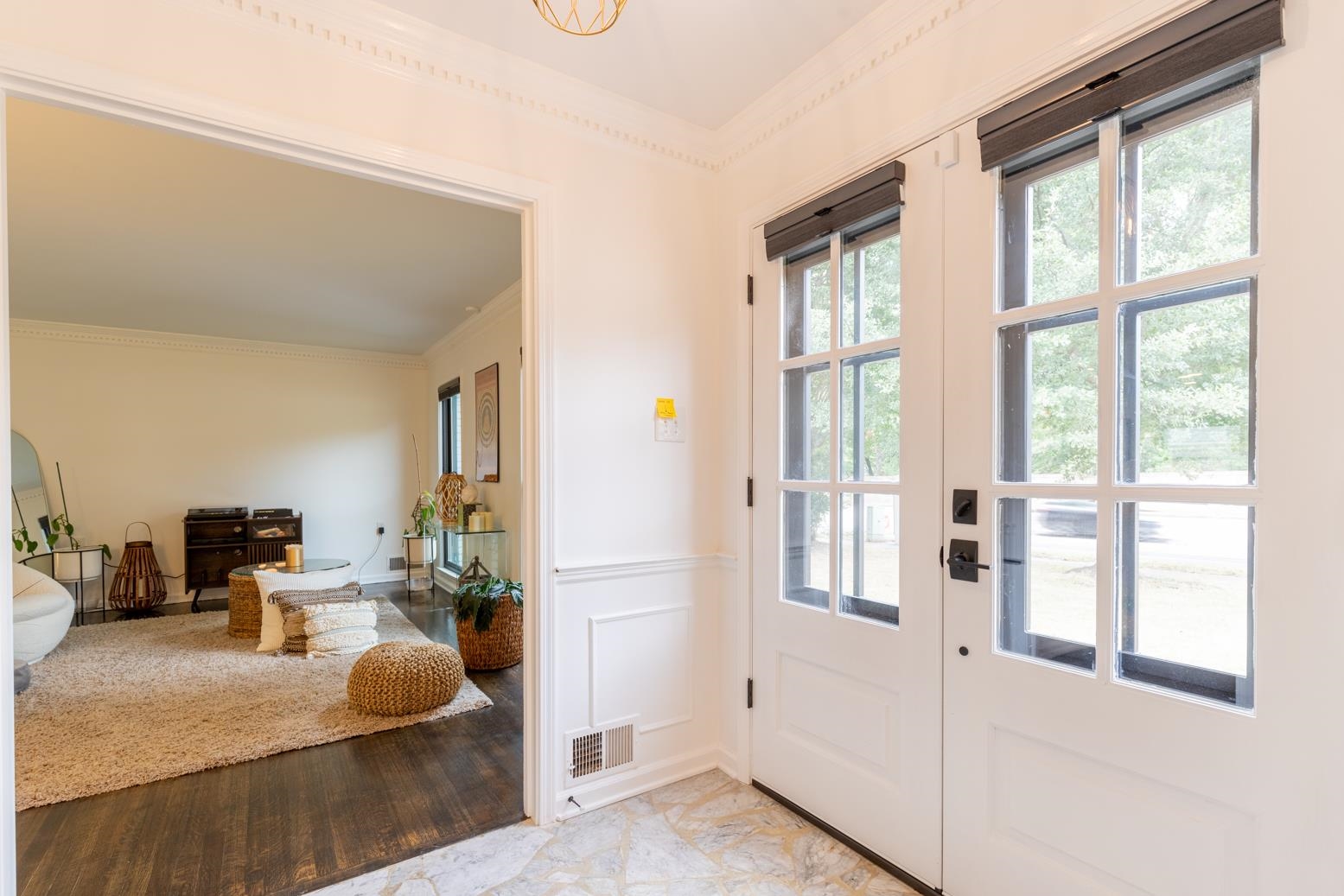 6270 Quince Road Memphis, TN 38119 - Photo 3 of 28 Doorway to outside with crown molding and light hardwood / wood-style floors