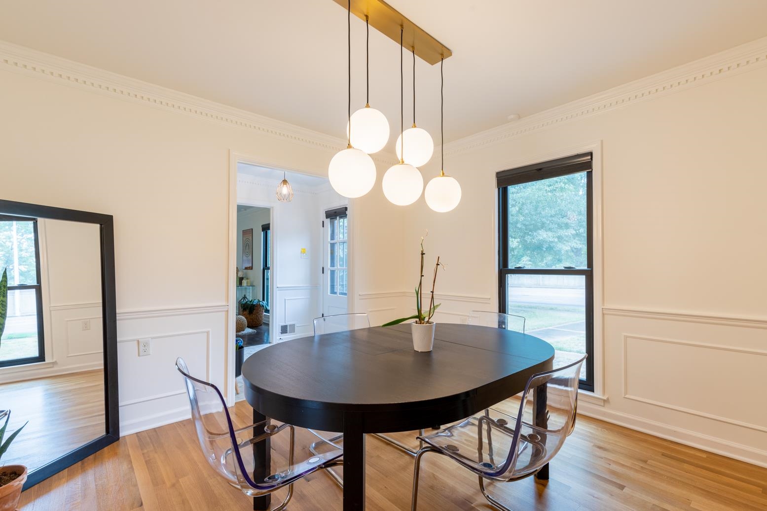 6270 Quince Road Memphis, TN 38119 - Photo 6 of 28 Dining room with crown molding, light hardwood / wood-style flooring, and a notable chandelier