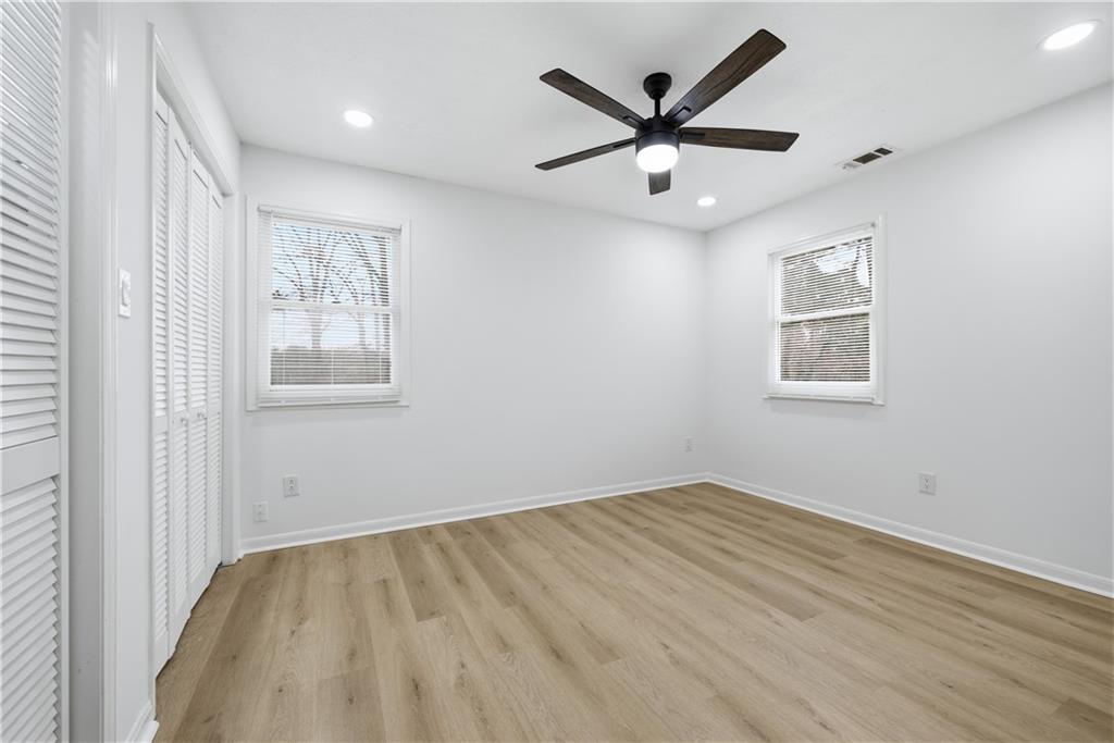 2095 Mulkey Road Southwest Marietta, GA 30008 - Photo 25 of 32 wooden floor in an empty room with a window