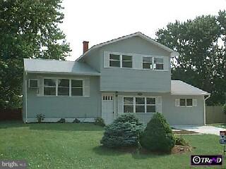 1117 Greentree Road Newark, DE 19713 - Photo 1 of 1 a front view of a house with a garden and yard