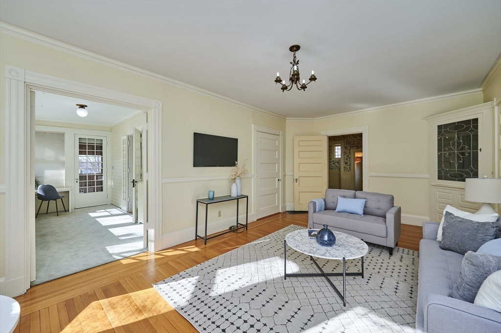32 Lenox Street Newton, MA 02465 - Photo 11 of 36 a living room with furniture and a flat screen tv