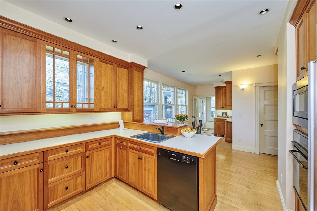 32 Lenox Street Newton, MA 02465 - Photo 15 of 36 a kitchen with a sink stove and cabinets