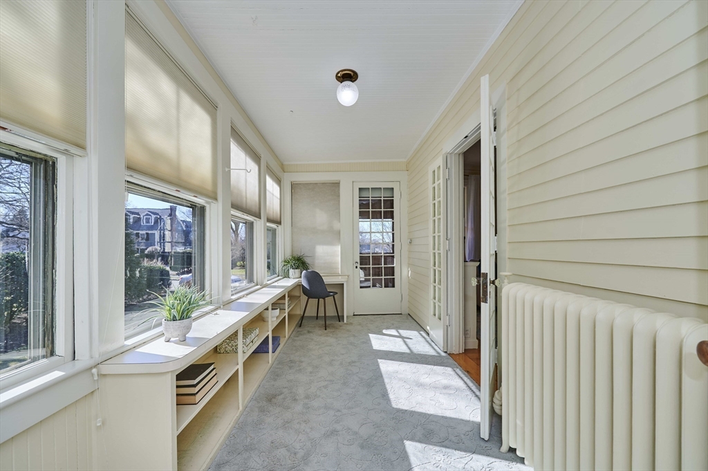 32 Lenox Street Newton, MA 02465 - Photo 19 of 36 a room with furniture and a window