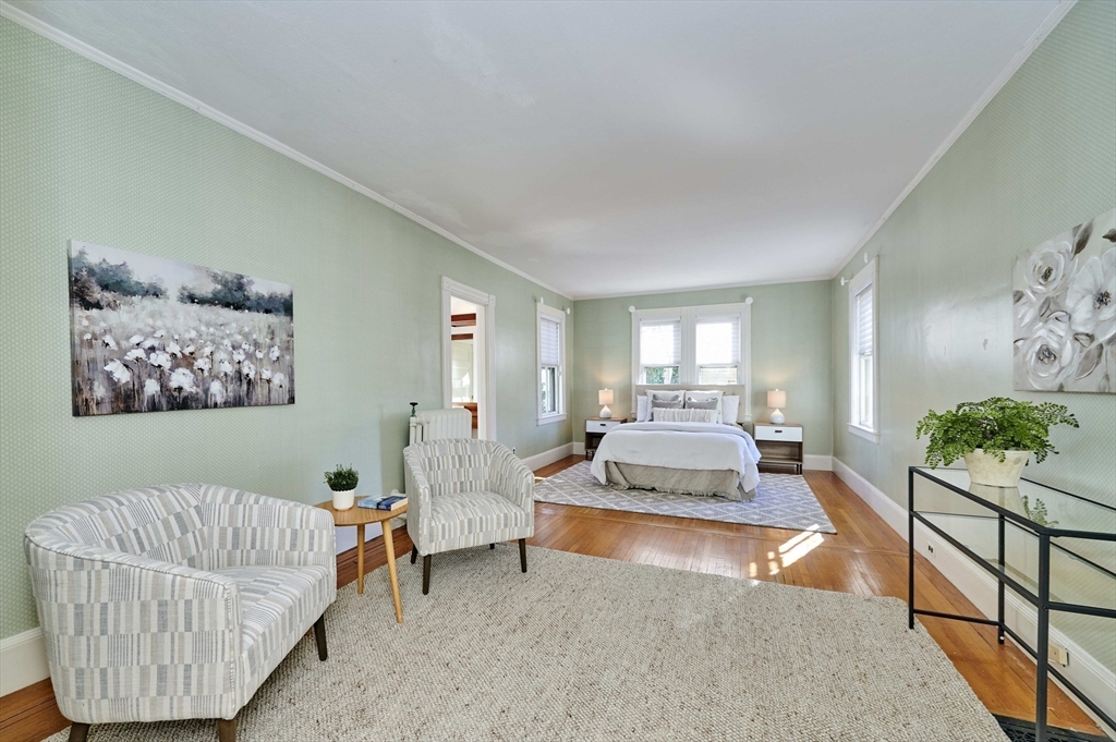 32 Lenox Street Newton, MA 02465 - Photo 23 of 36 a living room with furniture and a table