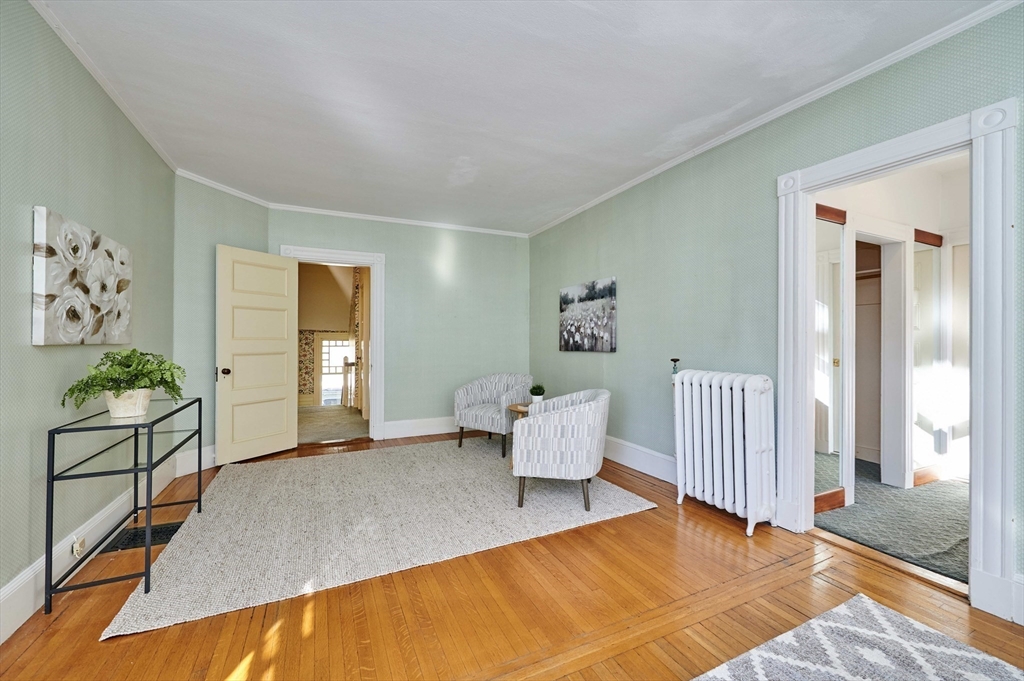 32 Lenox Street Newton, MA 02465 - Photo 24 of 36 a spacious bedroom with a bed and window