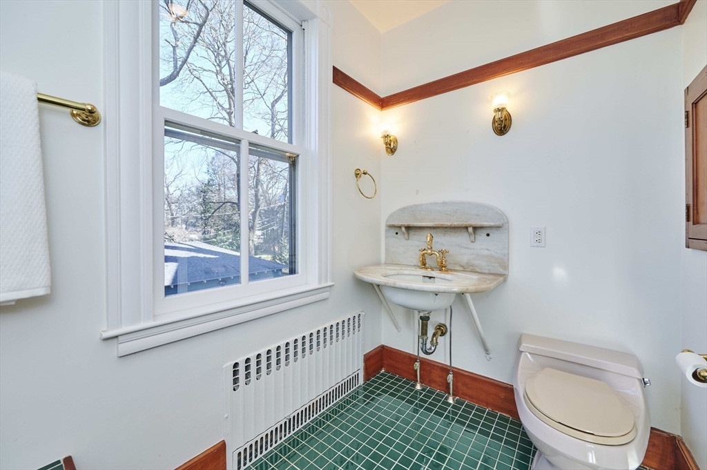 32 Lenox Street Newton, MA 02465 - Photo 26 of 36 a bathroom with a sink a toilet and a window