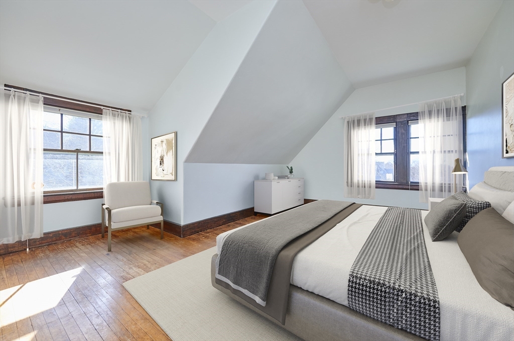 32 Lenox Street Newton, MA 02465 - Photo 29 of 36 a bedroom with a bed and large windows