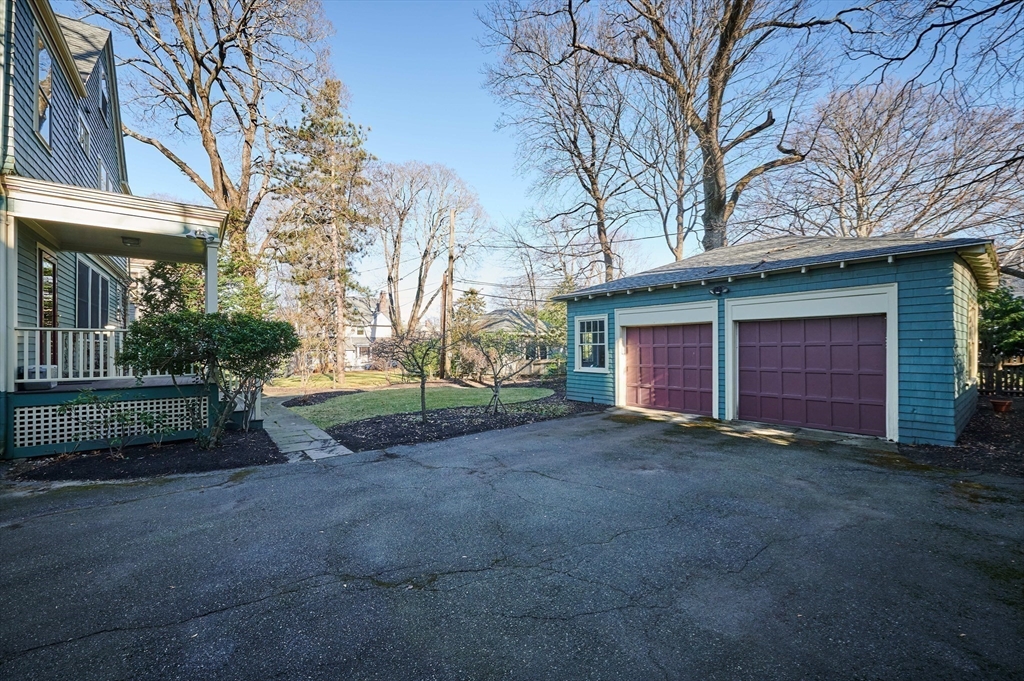 32 Lenox Street Newton, MA 02465 - Photo 34 of 36 a view of a house with a yard and garage