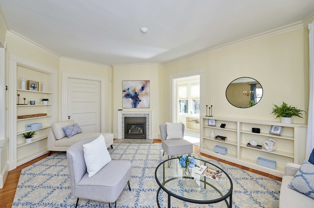 32 Lenox Street Newton, MA 02465 - Photo 8 of 36 a living room with furniture a rug and a mirror