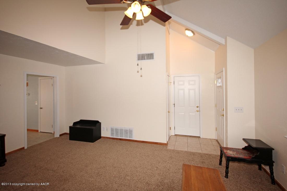 5216 Leland Drive Amarillo, TX 79110 - Photo 4 of 23 a view of livingroom with hardwood floor and a ceiling fan
