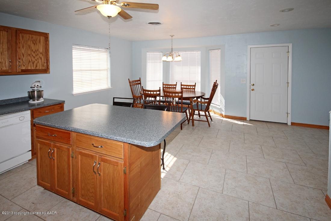 5216 Leland Drive Amarillo, TX 79110 - Photo 8 of 23 a view of a dining room with furniture and chandelier