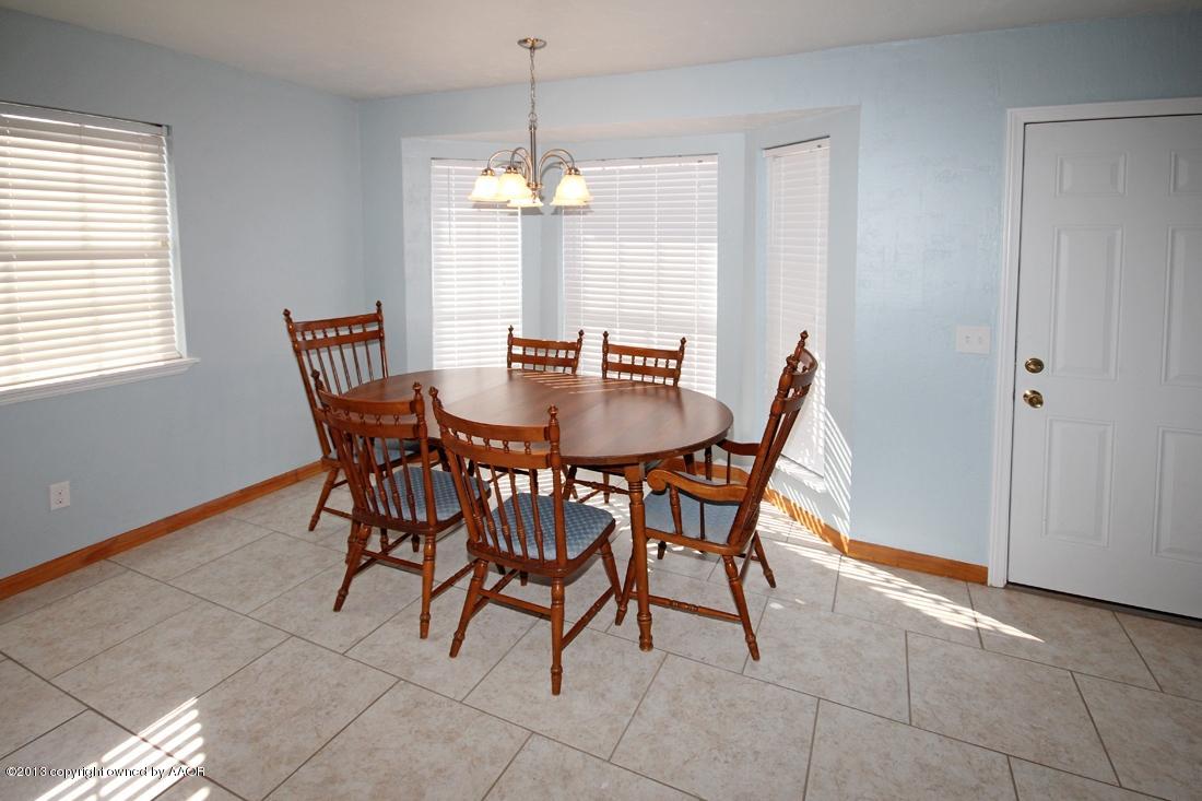 5216 Leland Drive Amarillo, TX 79110 - Photo 9 of 23 a view of a dining room with furniture and chandelier