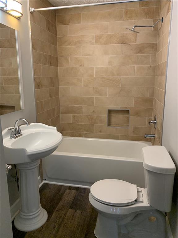 1261 Concord Road Southeast Smyrna, GA 30080 - Photo 15 of 50 a bathroom with a sink a toilet and bathtub